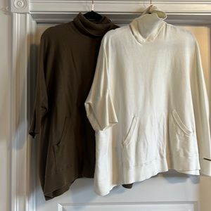 Two Michael kors ponchos together.